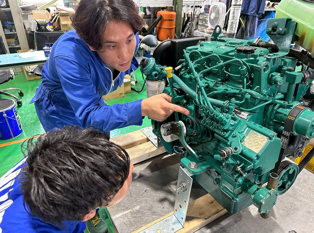 〈古里さん〉
